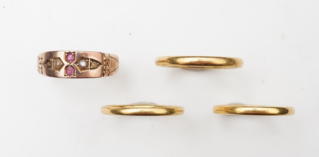 A collection of four gold rings